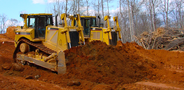 Skilled operators and 87 tons of bulldozers working side by side.