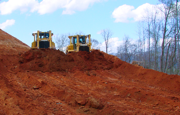 Two 87,000 pound bulldozers constructing a road in Asheville, N.C.